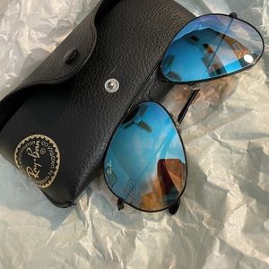 Ray-Ban aviators. Black frame. Blue lens.